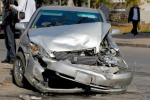 A view of the front end of a car damaged in an accident