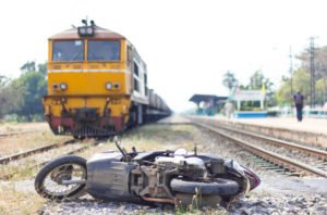motorcycle overturned on train tracks