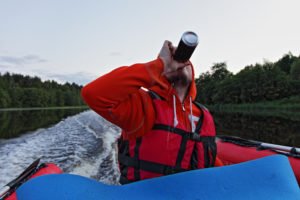 boater drinking a beer while driving
