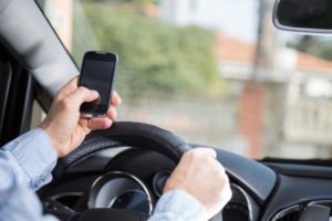 close-up on texting driver