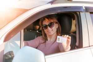 girl showing driver’s license