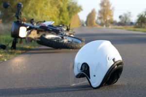close-up on helmet on the ground after motorcycle accident