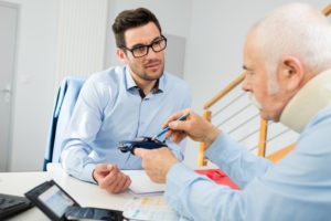 injured man consults with a car accident attorney