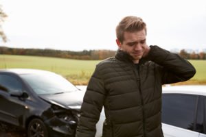 man suffers neck pain after car wreck