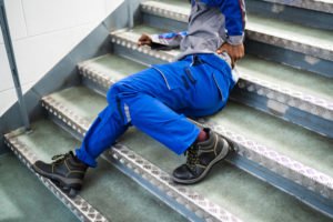 worker falls down stairs