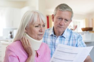 couple reads medical bill after doctor visit