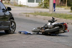 motorcycle damaged after collision with car
