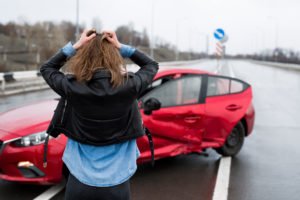 woman distraught after car wreck