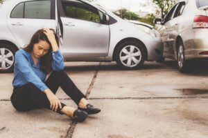 woman distressed after car crash